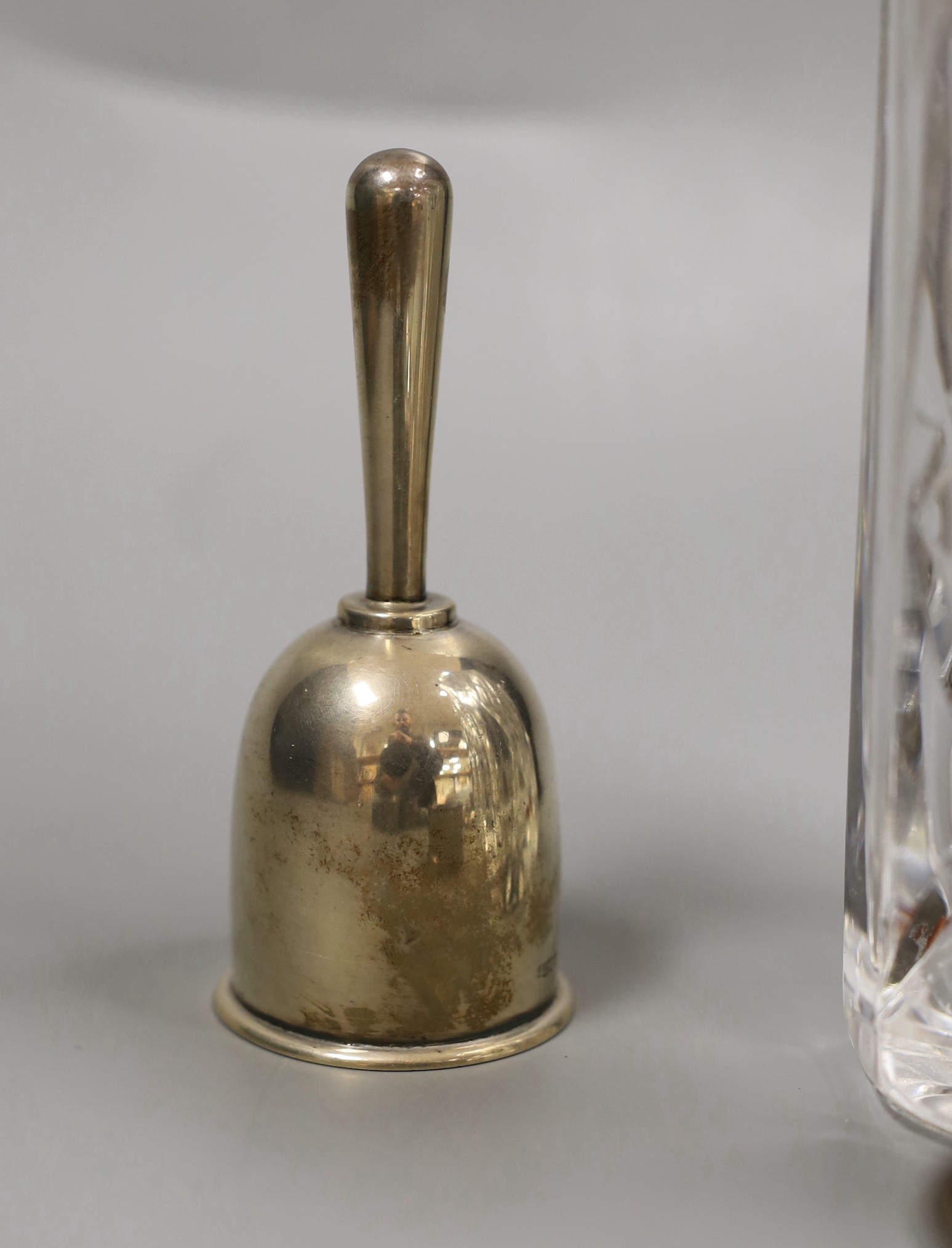 Mixed silver items etc. including a modern silver collared glass decanter, cigarette box, 800 standard white metal cake tongs, a white metal hand bell(lacking clapper), six plated Noritake tea forks, assorted minor silve